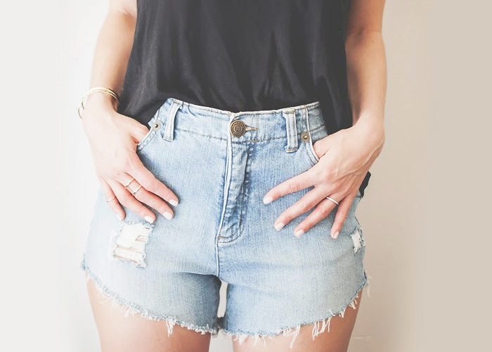 distressed shorts with pockets showing