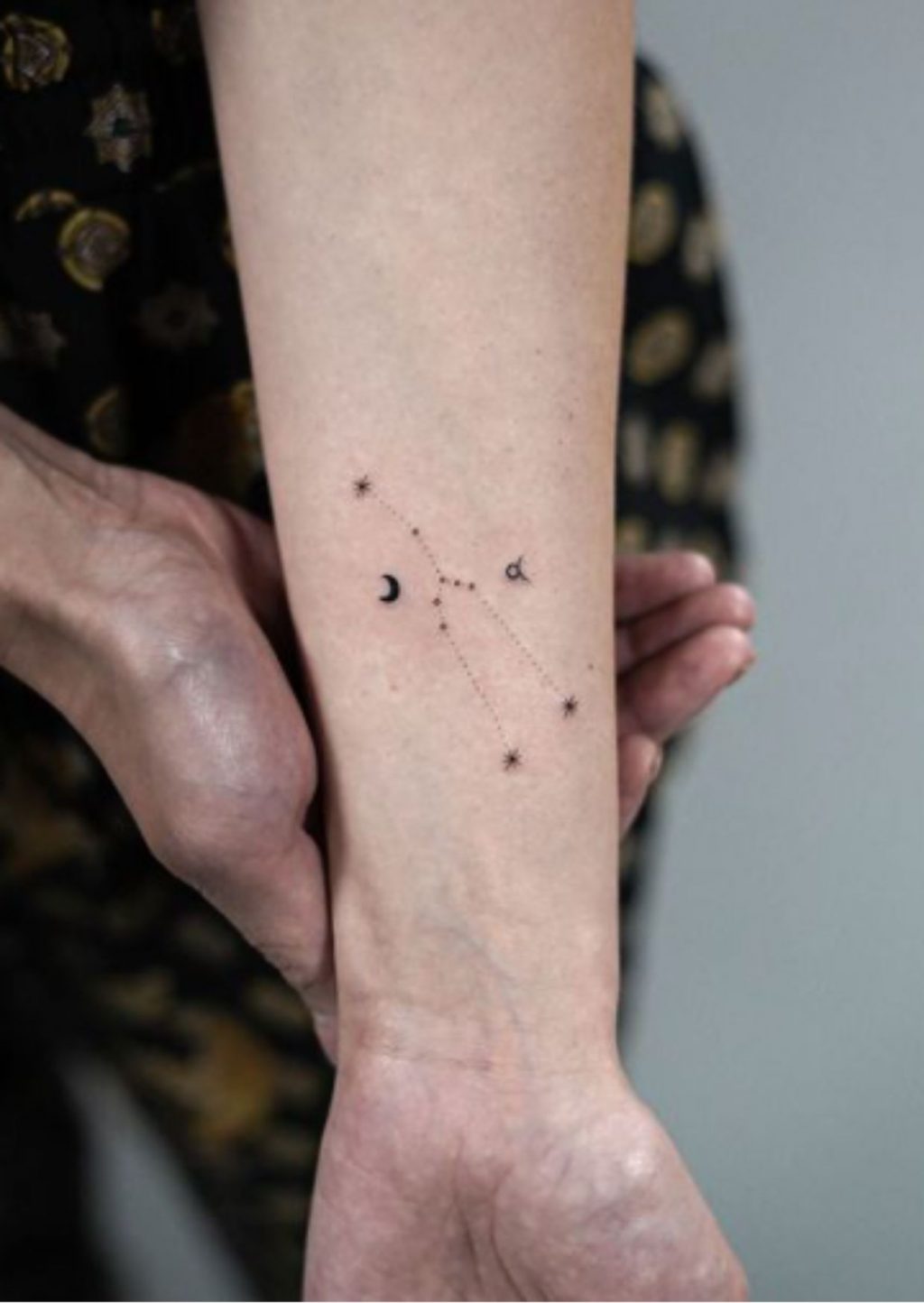 Taurus constellation tattoo on the right inner wrist