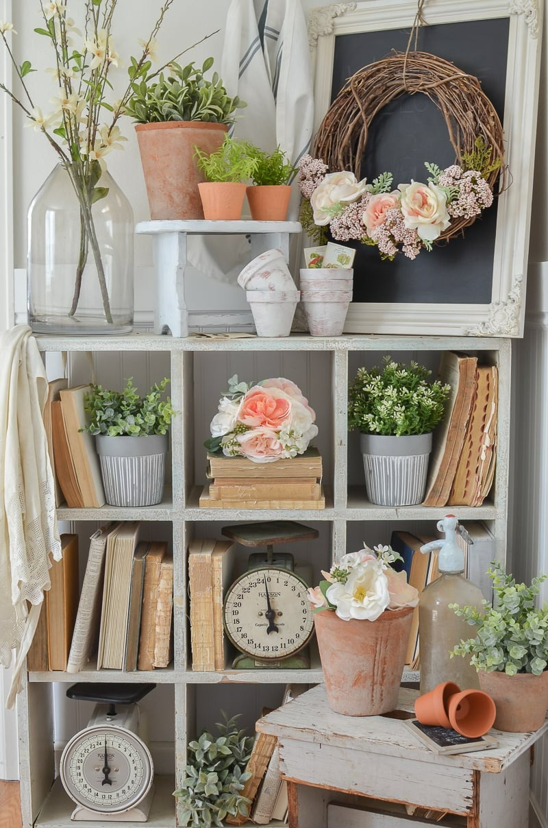 Cube shelving with antique books and spring florals