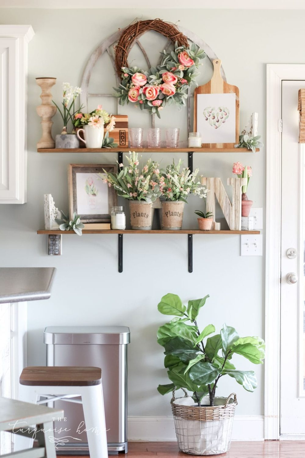 Shelving with potted Spring flowers