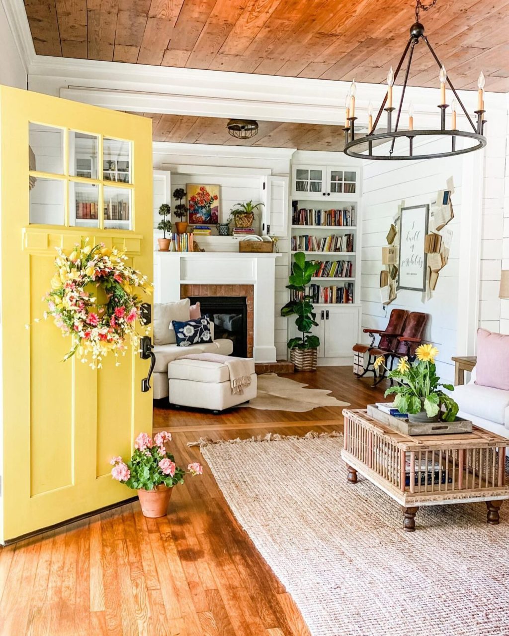 Yellow front door with spring flowers