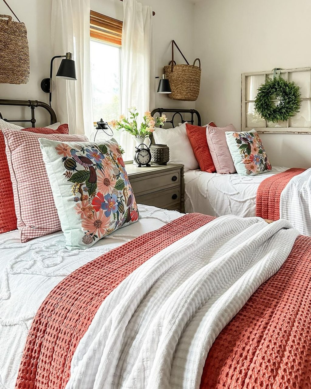 Rusty red bedding with floral pillows
