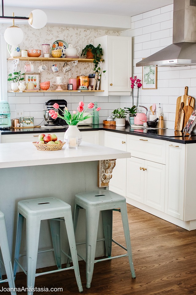 Open shelving kitchen with spring mugs and flowers