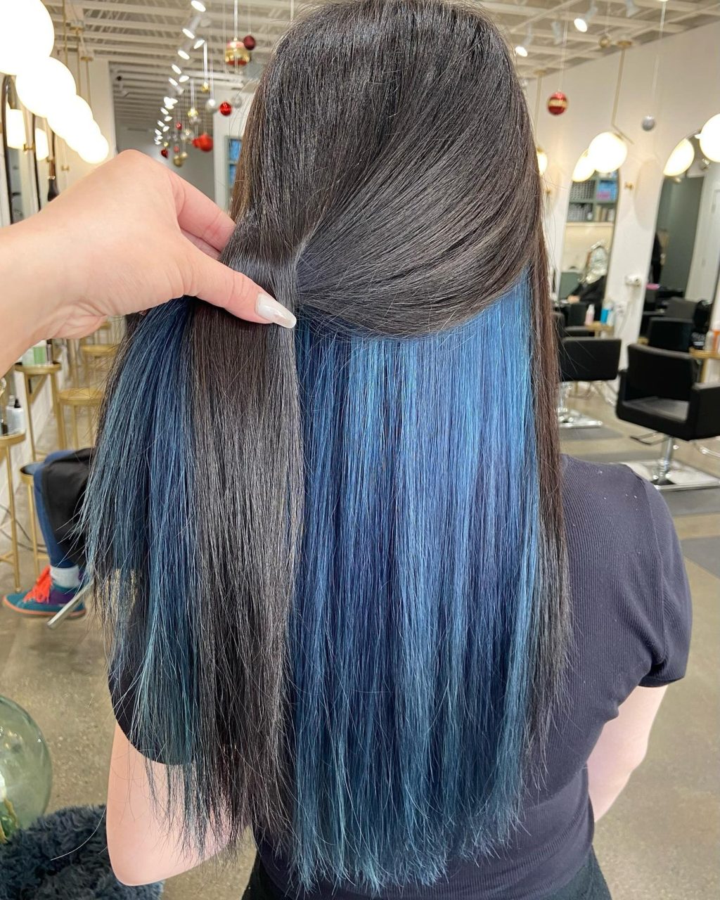 Black hair with peekaboo blue highlights